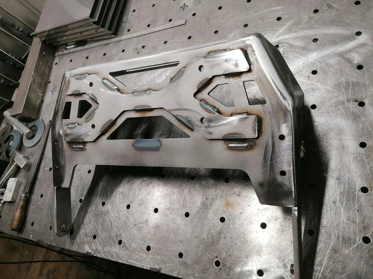 Full view of Overland-G front bumper winch mount structure during fabrication