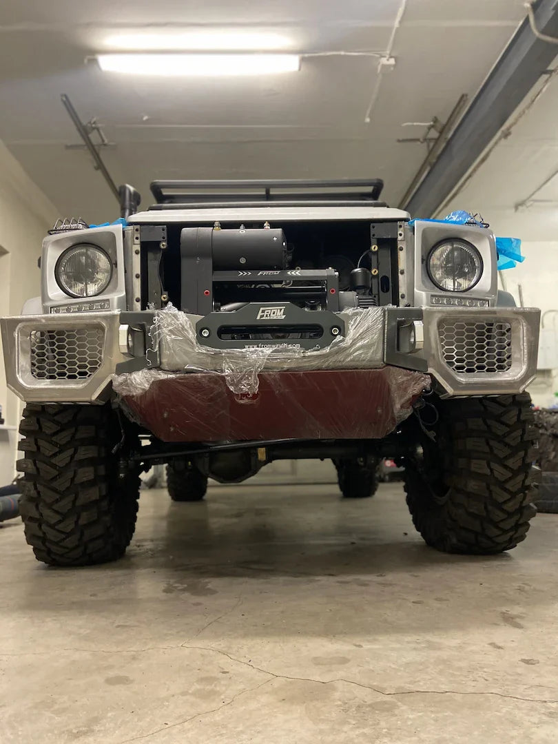Overland-G aluminum front bumper test fit showing integration with underbody protection plate
