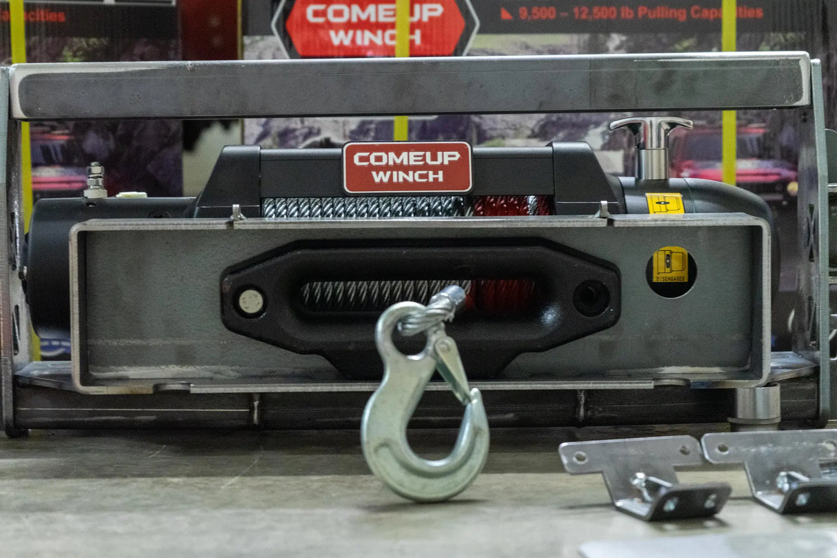 Overland-G winch system single-motor mounting process step 4 showing bracket alignment