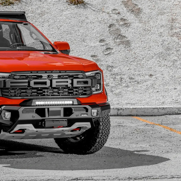 Ford Ranger off-road build with underbody protection, heavy-duty bumpers and expedition roof rack setup.