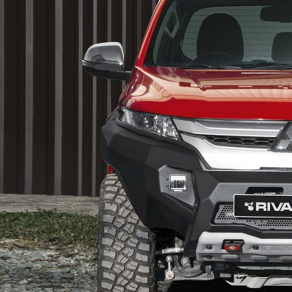 Mitsubishi L200 off-road and overland upgrades with skid plates, bumpers and roof rack system.