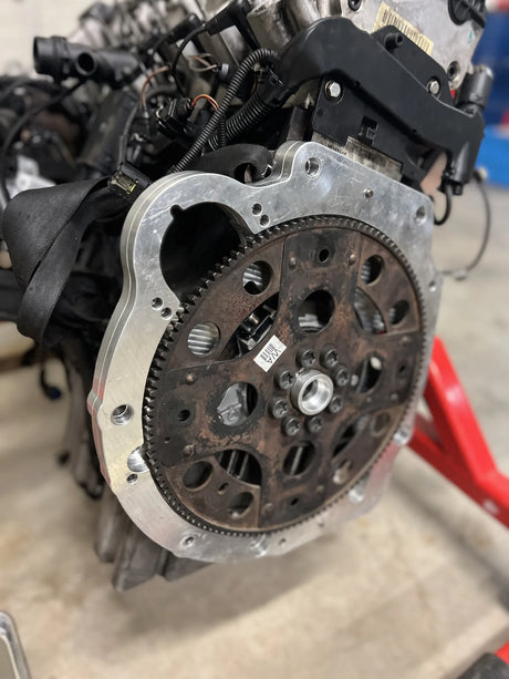 Close-up of a mechanical engine component on a blurred background