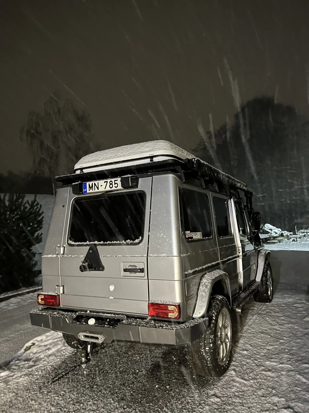 Exterior view of Overland-G aluminum rear bumper installed on G-Class showing spare wheel carrier integration