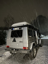Exterior view of Overland-G aluminum rear bumper installed on G-Class showing spare wheel carrier integration