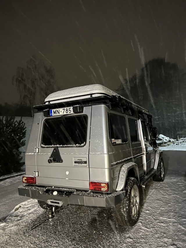 Exterior view of Overland-G aluminum rear bumper installed on G-Class showing spare wheel carrier integration