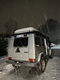 Exterior view of Overland-G aluminum rear bumper installed on G-Class showing spare wheel carrier integration