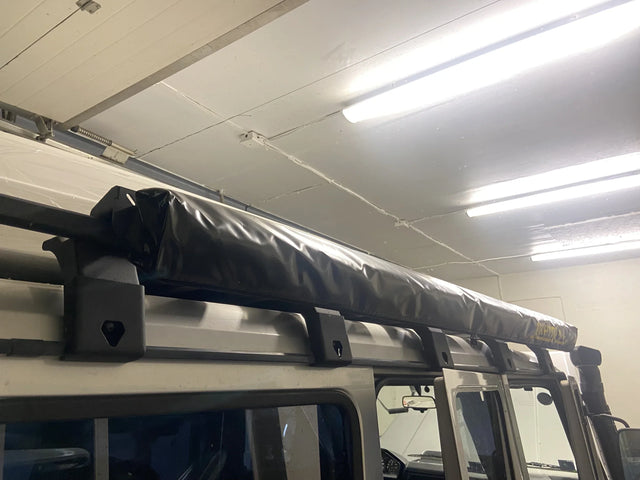Overland-G expedition roof rack on Mercedes-Benz G-Class with side awning deployed