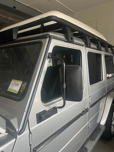 Overland-G expedition roof rack viewed from driver side mirror perspective on G-Class