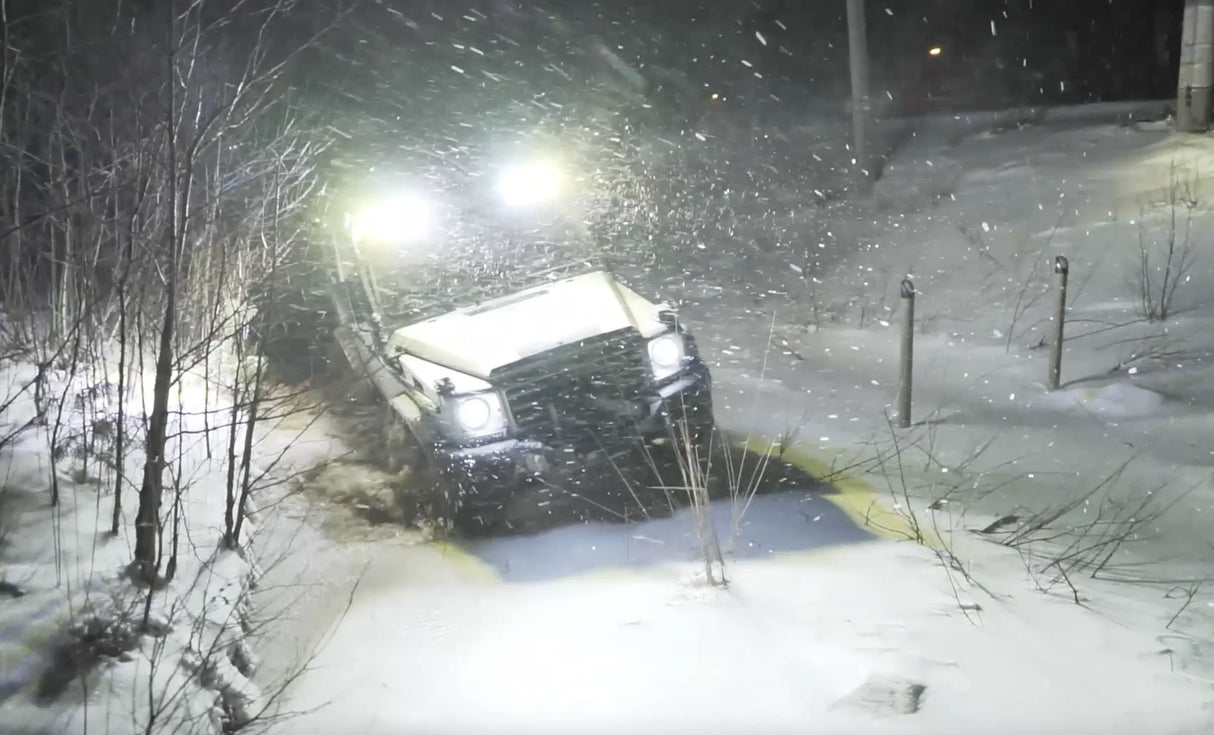 Overland-G perimeter lighting kit active during winter night drive in snow
