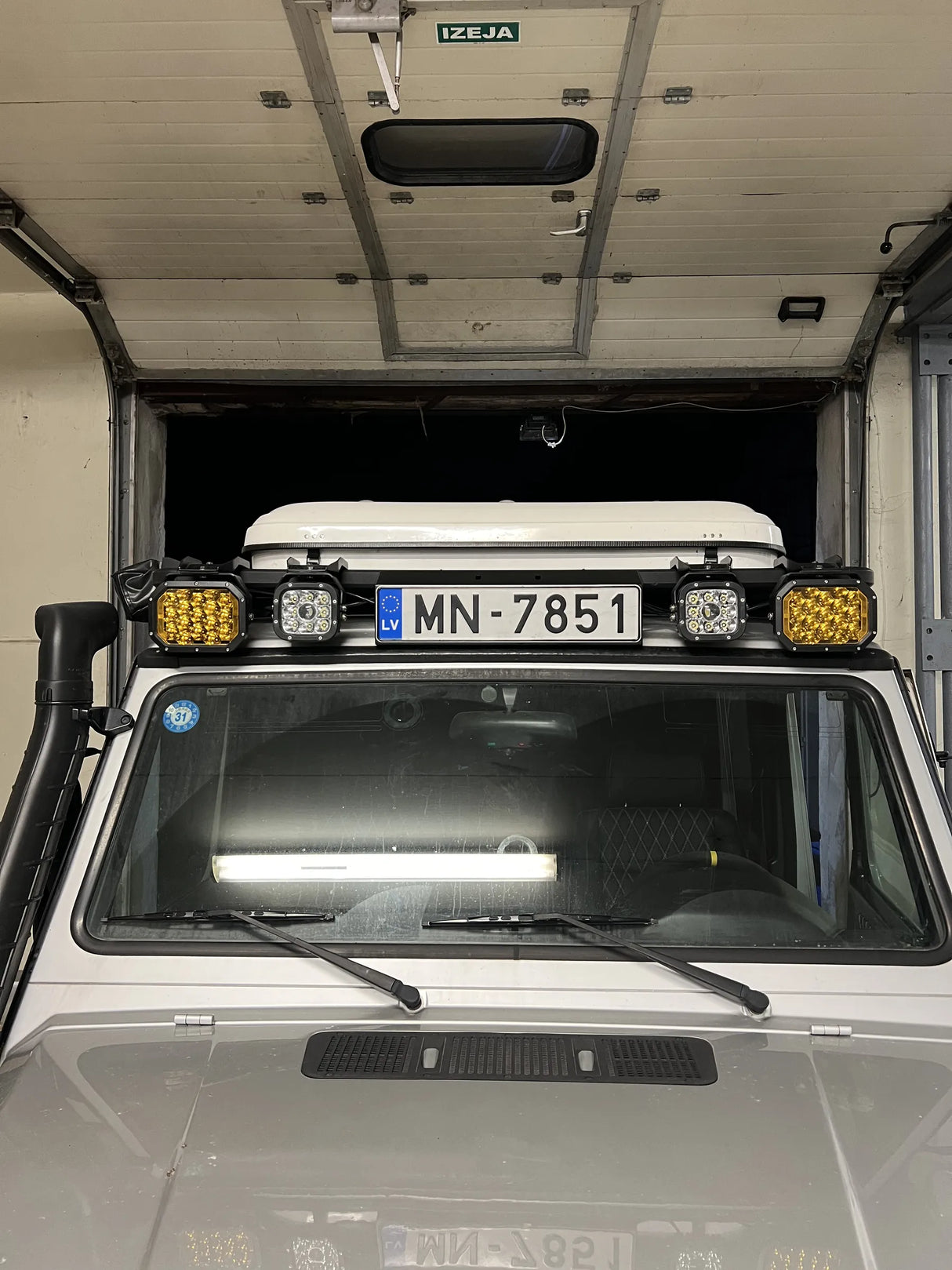 Overland-G roof front number plate relocation kit installed overview showing plate position on roof