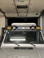 Overland-G roof front number plate relocation kit installed overview showing plate position on roof